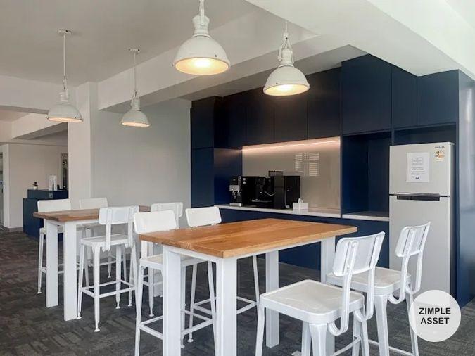 picture Office for rent with modern coworking space, Blue Chips Thonglor Building. Inside is a modern lobby that opens up to a contemporary office space. - 5/9