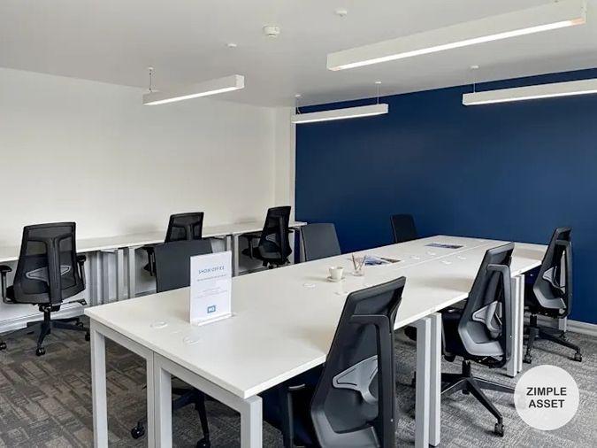 picture Office for rent with modern coworking space, Blue Chips Thonglor Building. Inside is a modern lobby that opens up to a contemporary office space. - 7/9