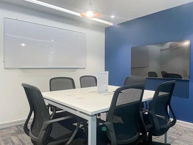 picture Office for rent with modern coworking space, Blue Chips Thonglor Building. Inside is a modern lobby that opens up to a contemporary office space. - 6/9