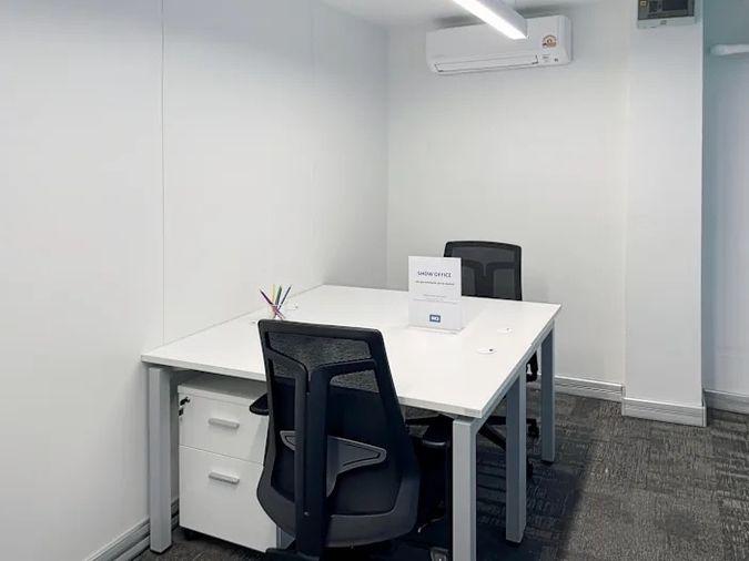 picture Office for rent with modern coworking space, Blue Chips Thonglor Building. Inside is a modern lobby that opens up to a contemporary office space. - 9/9