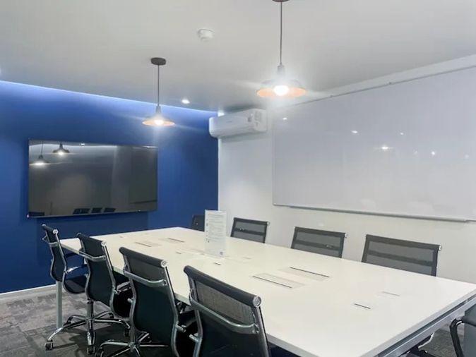 picture Office for rent with modern coworking space, Blue Chips Thonglor Building. Inside is a modern lobby that opens up to a contemporary office space. - 2/9