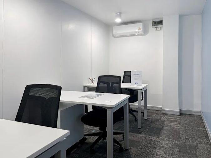 picture Office for rent with modern coworking space, Blue Chips Thonglor Building. Inside is a modern lobby that opens up to a contemporary office space. - 8/9