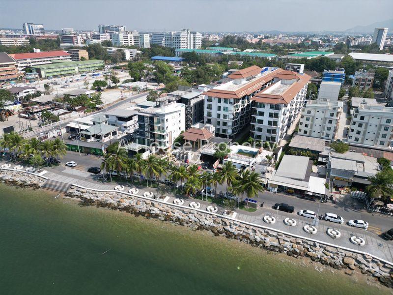 picture Beachfront land for sale in Bang Saen, prime location, with existing structures. - 4/5