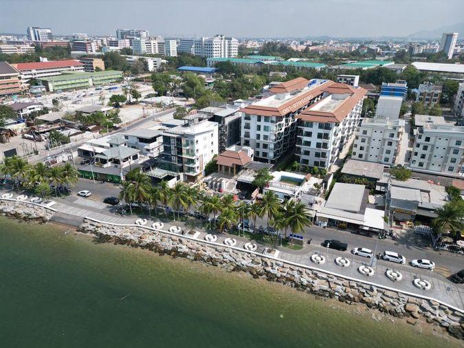 picture Beachfront land for sale in Bang Saen, prime location, with existing structures. - 4/5